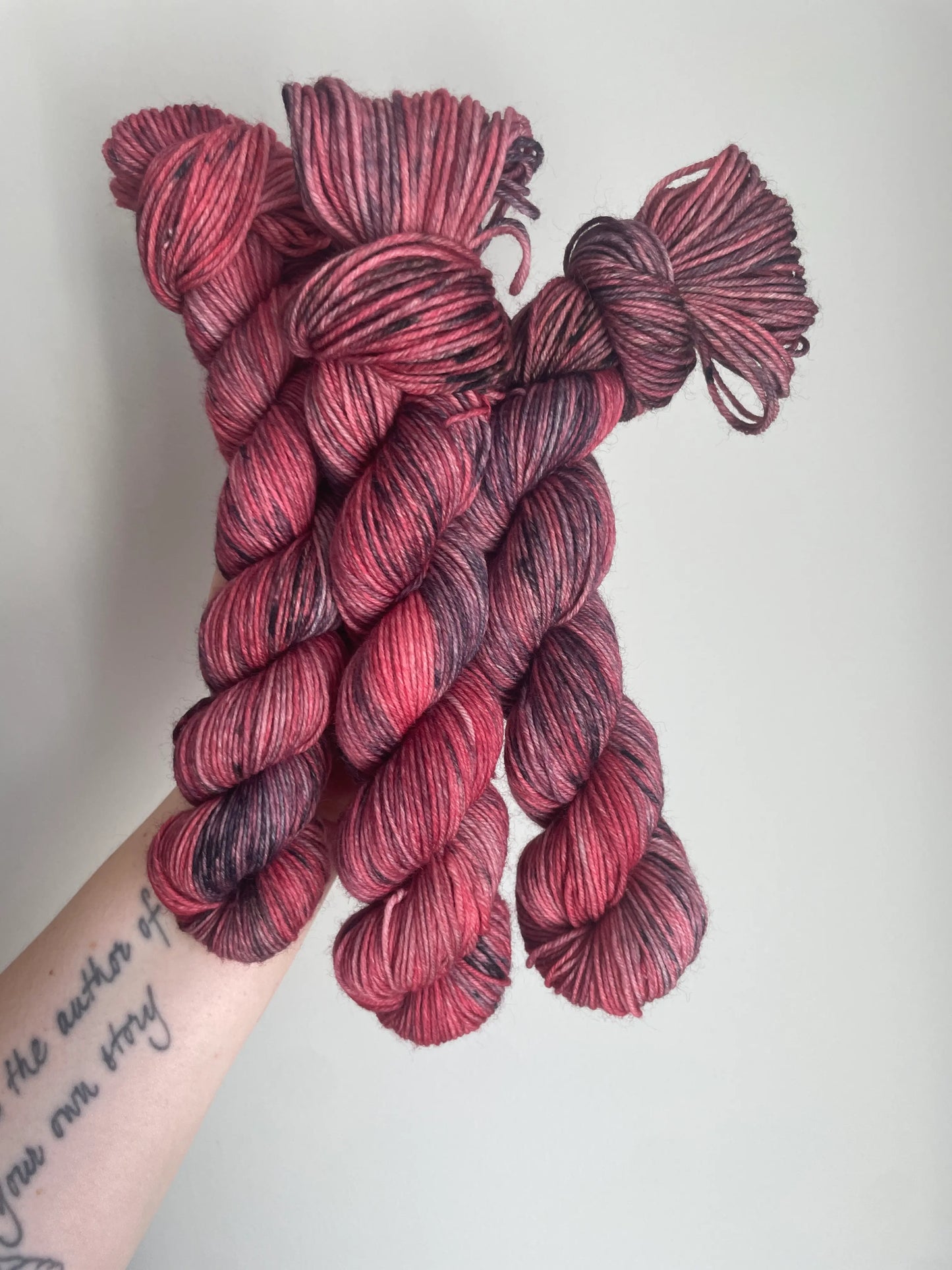 SockaMerino 50g ”Jordgubb/lakrits”